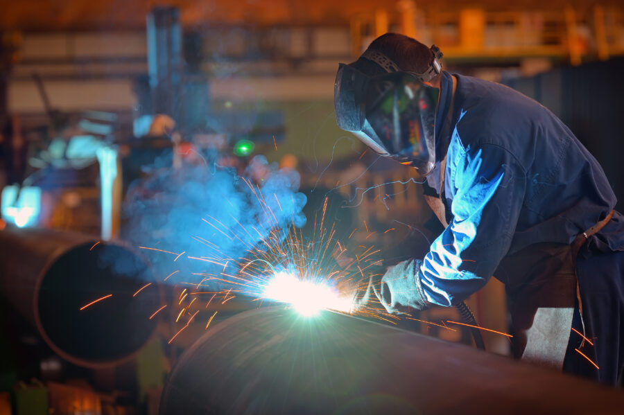 Welder performs welding large diameter pipe